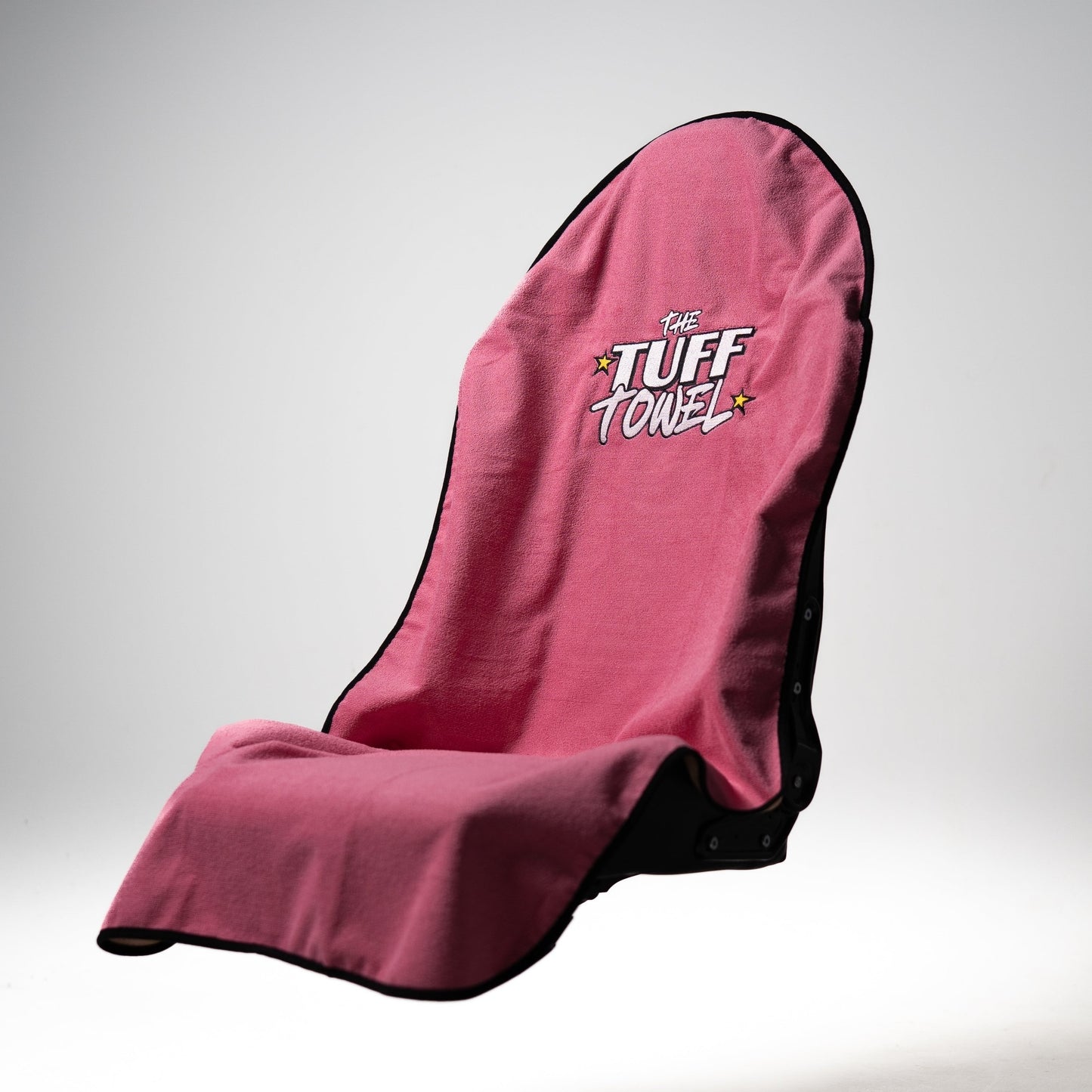 Pink Tuff Towel used as car seat protector after beach day with dog.